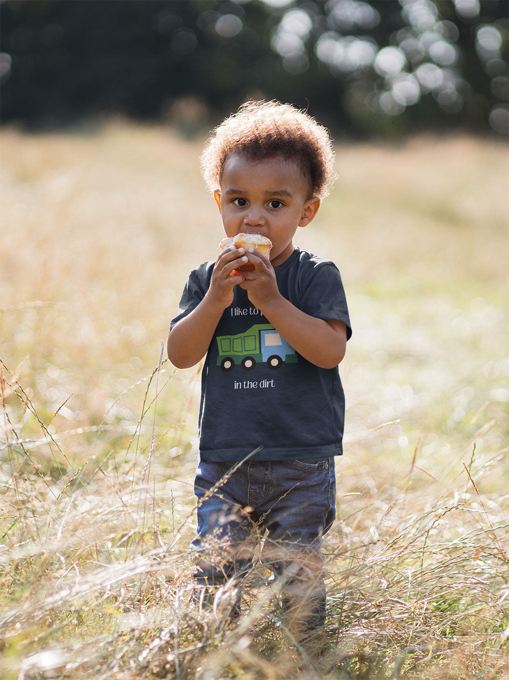boy in field wearing I Like to play in dirt truck- toddler tee - Navy