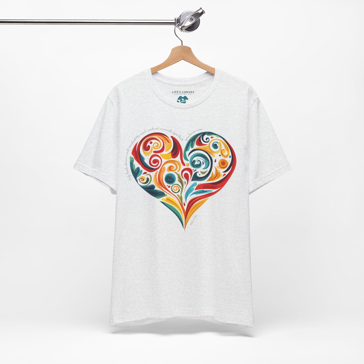 Unisex t-shirt with Stella Adler quote and heart swirl design on hanger- Ash