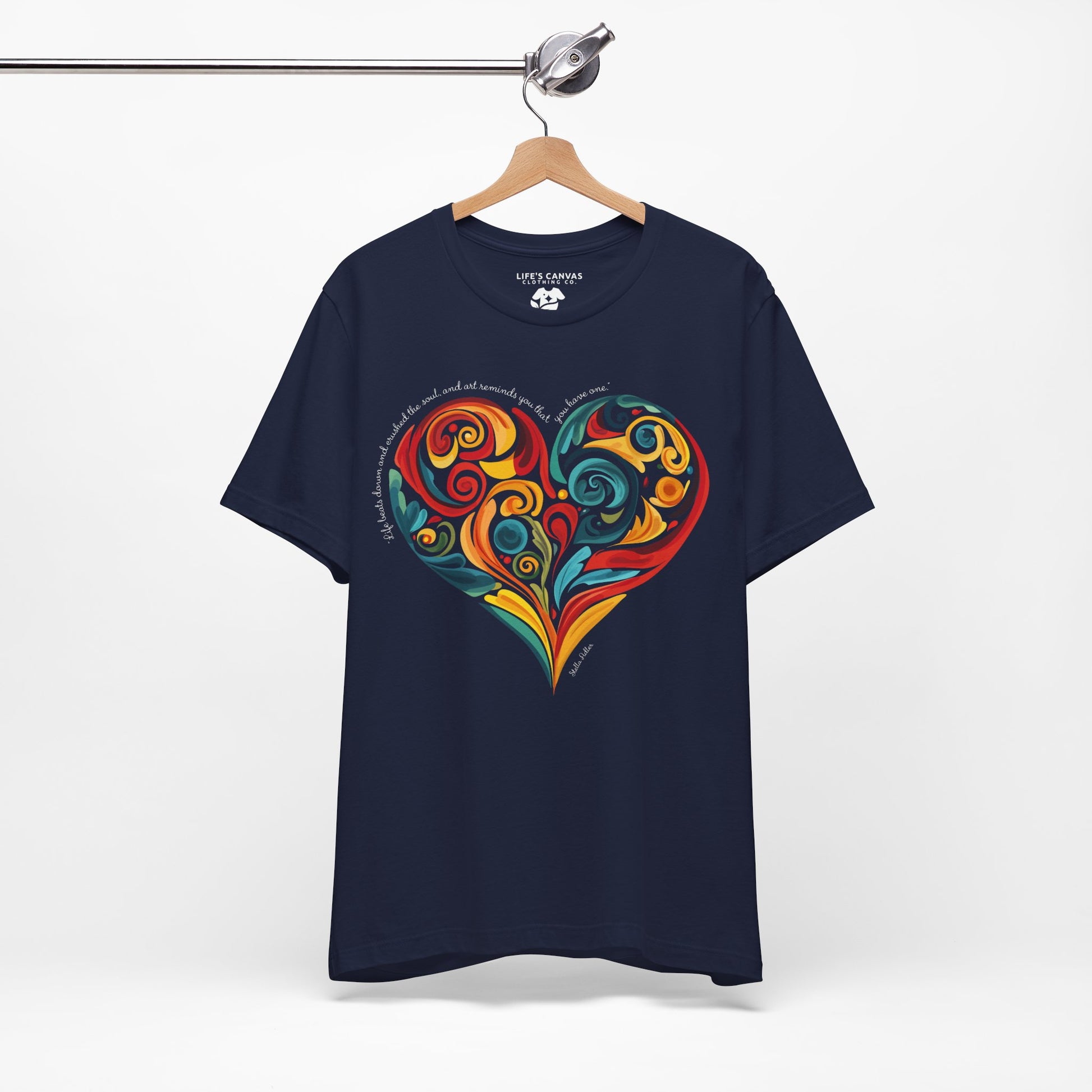 Unisex t-shirt with Stella Adler quote and heart swirl design on hanger- Navy