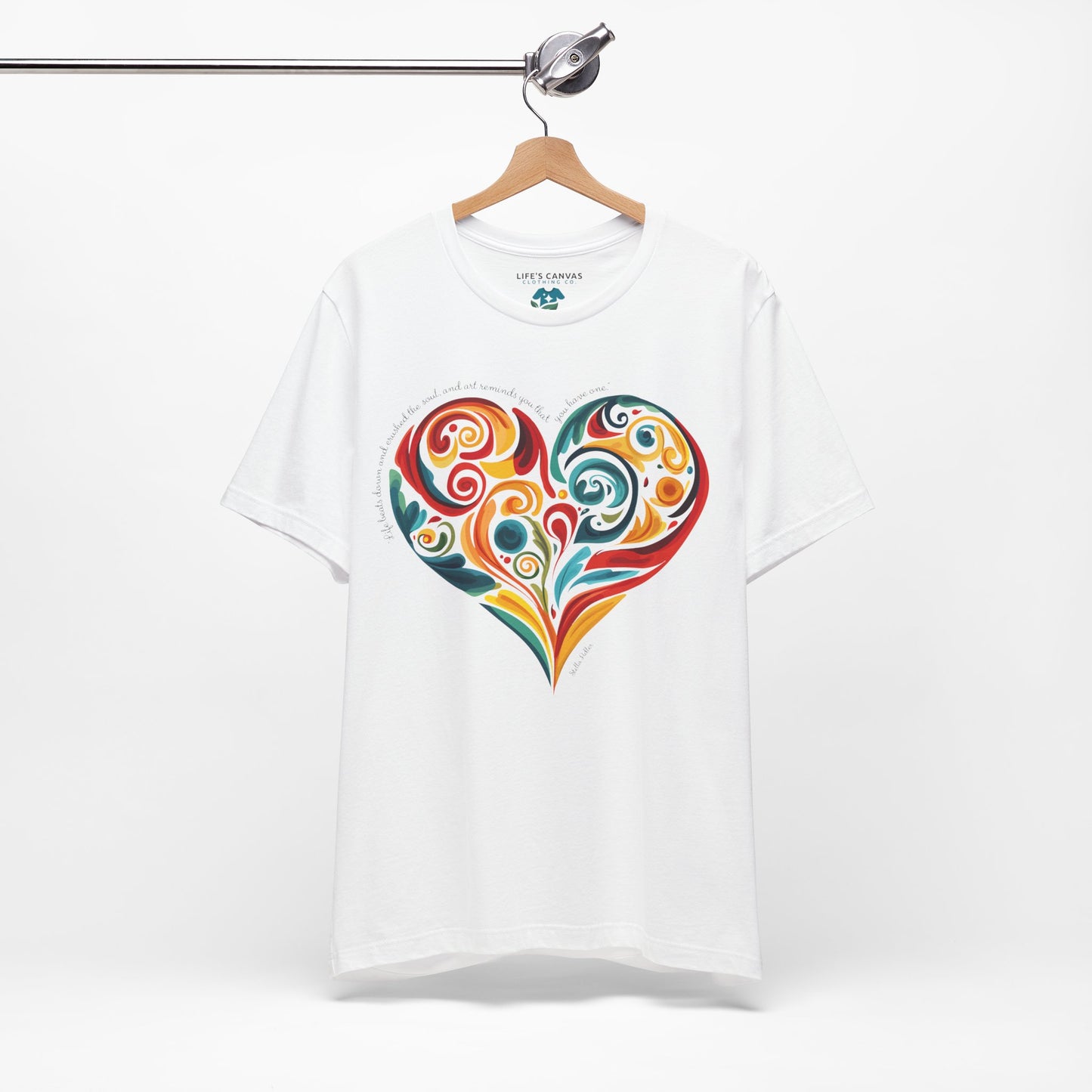 Unisex t-shirt with Stella Adler quote and heart swirl design on hanger- White