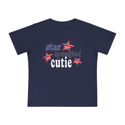 Navy Baby t-shrit laying flat with typography and patriotic stars, t-shirt says "star spangled cutie"