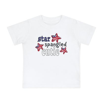 White Baby t-shrit laying flat with typography and patriotic stars, t-shirt says "star spangled cutie"