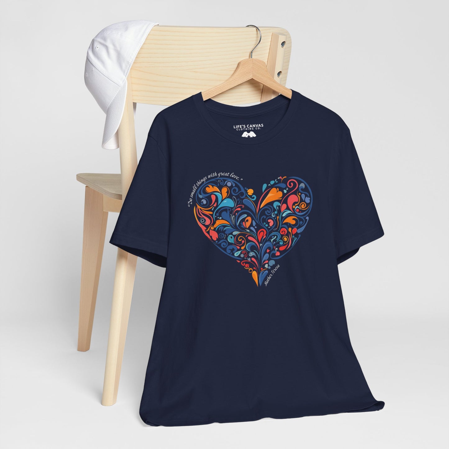  Kindness quote tee inspired by Mother Teresa hanging off a chair- Navy