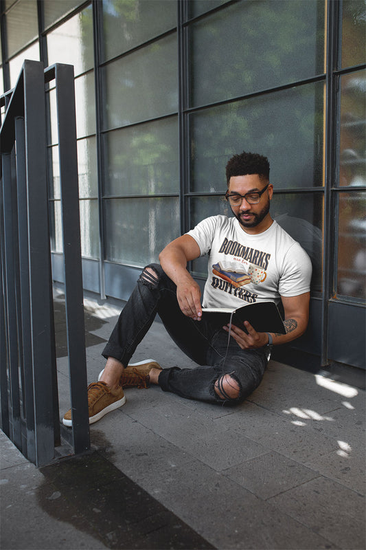 May outside  reading and wearing Bookmarks are for Quitters white t-shirt 