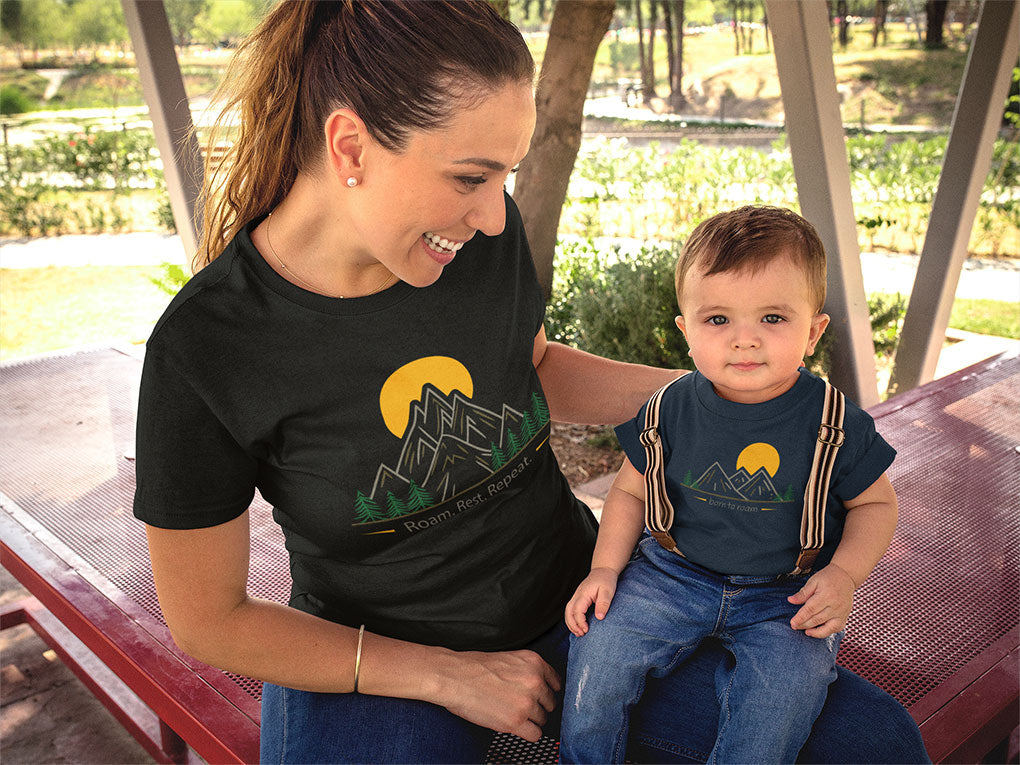Mom and baby wearing matching Roam t-shirts