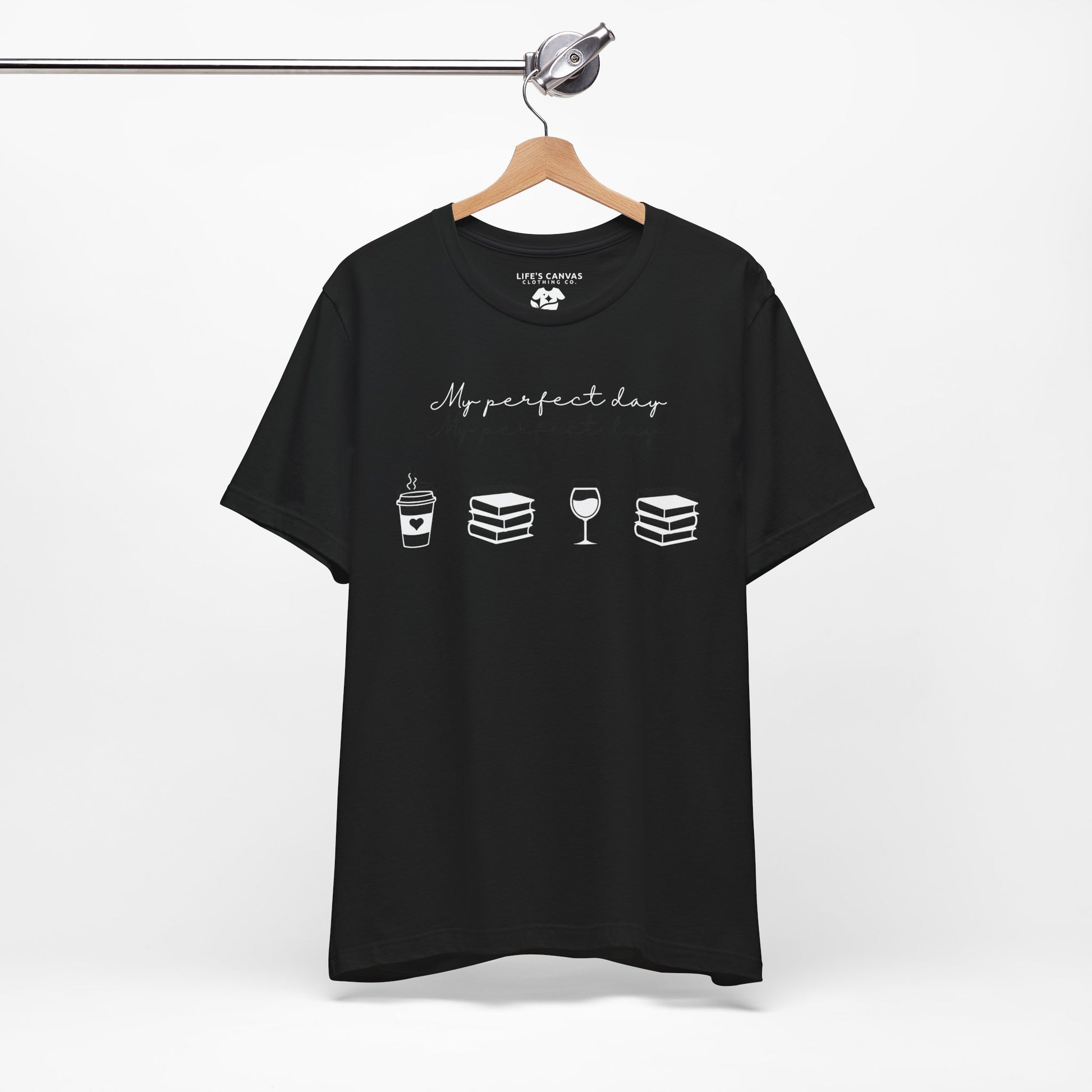Perfect day shirt for book lovers and introverts, coffee, wine, and books- hanging in black