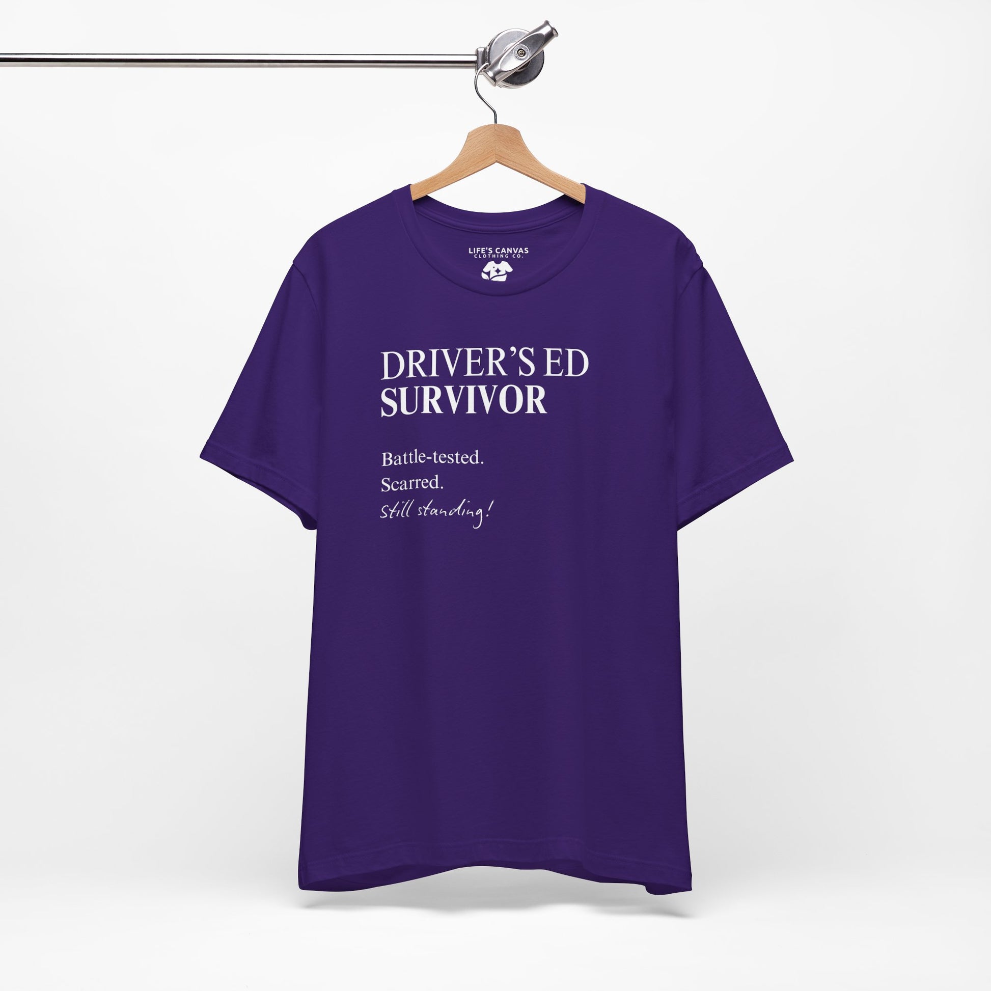 Team purple drivers ed survivor tee on hanger