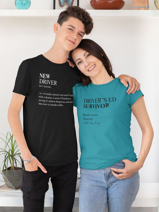 Teen in black new driver tee with parent in Drivers ed survivor tee, hugging and smiling