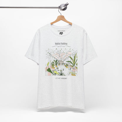 Unisex plant lover shirt that says “Habitat Building, It’s Not Hoarding” on a hanger in Ash