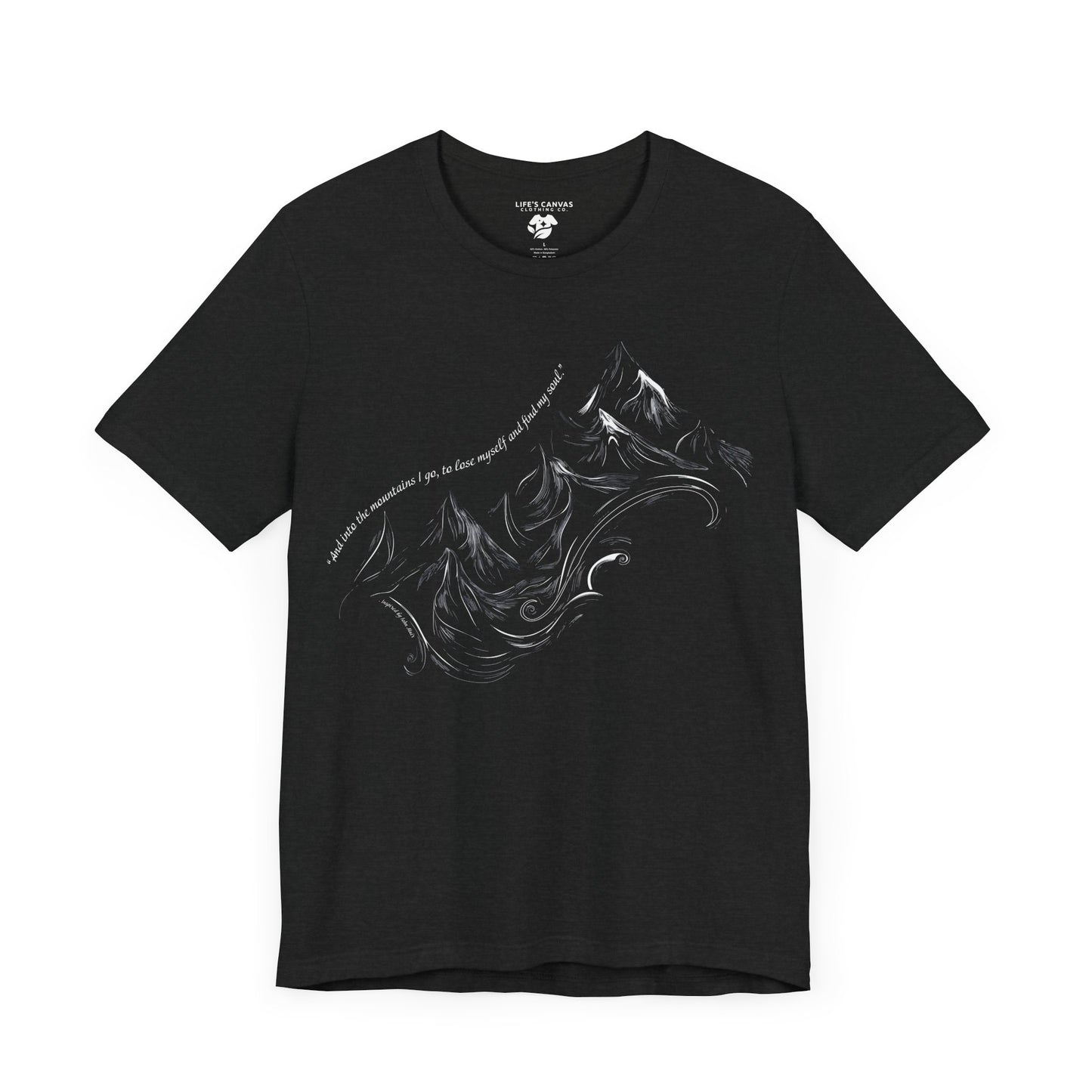 Unisex t-shirt with sketched mountain design and John Muir quote “Into the Mountains I go...”- Black t-shirt laying flat