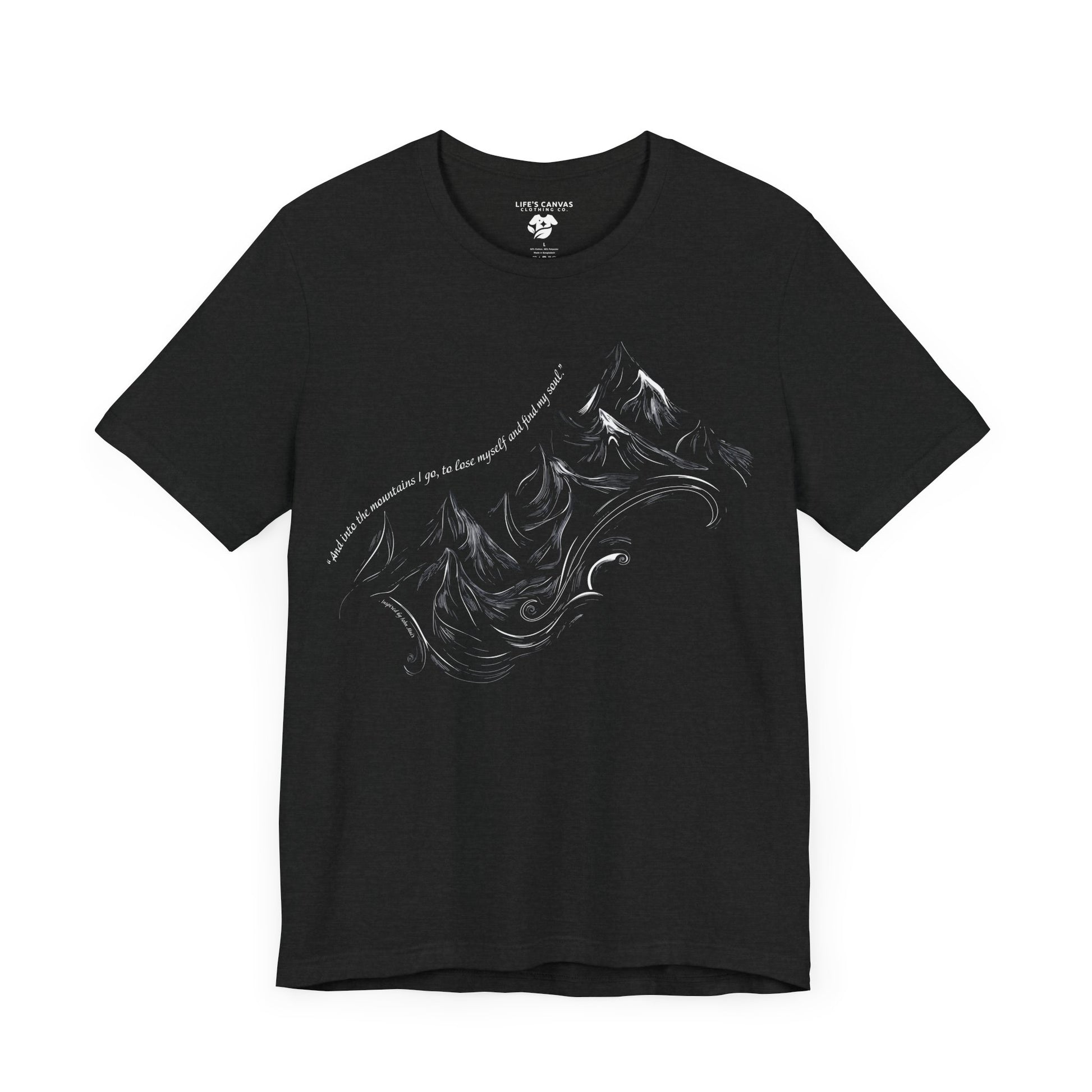 Unisex t-shirt with sketched mountain design and John Muir quote “Into the Mountains I go...”- Black t-shirt laying flat