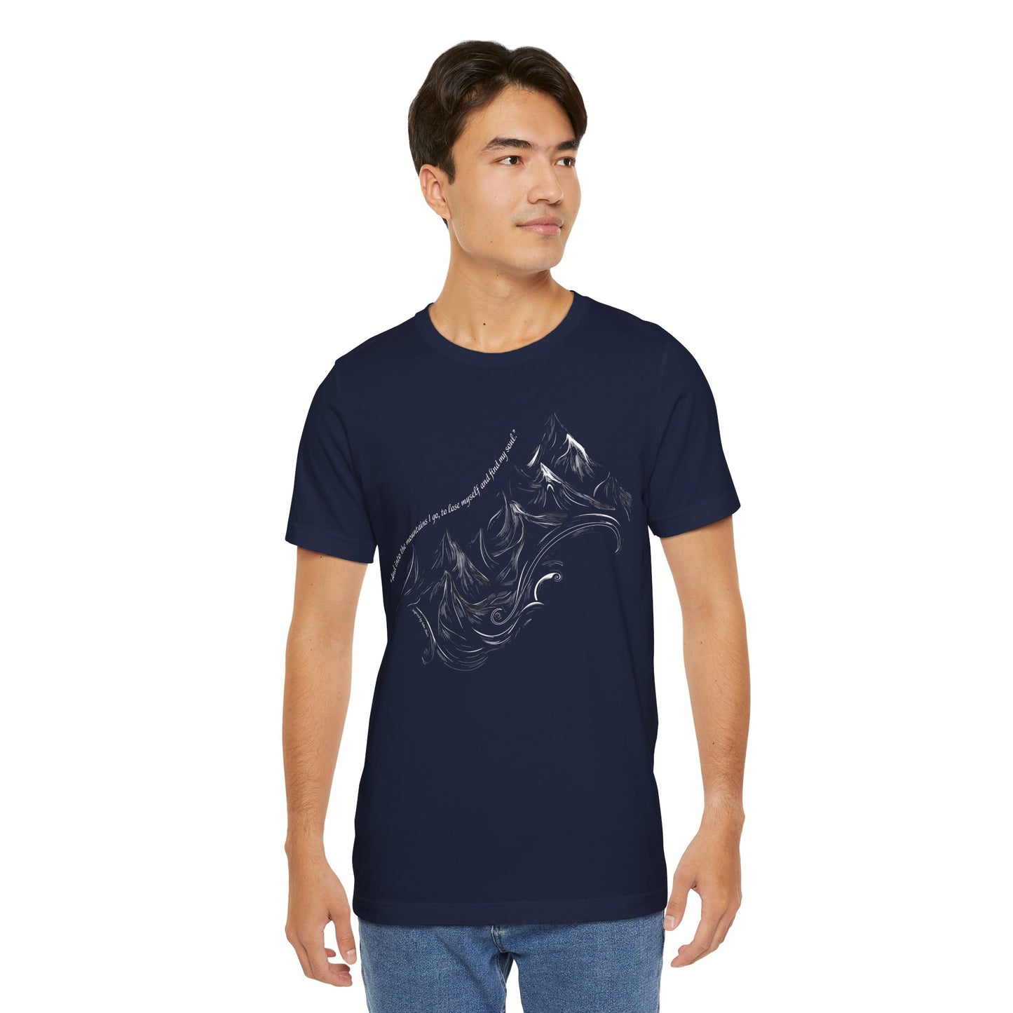 Unisex t-shirt with sketched mountain design and John Muir quote “Into the Mountains I go...”- Navy on a model