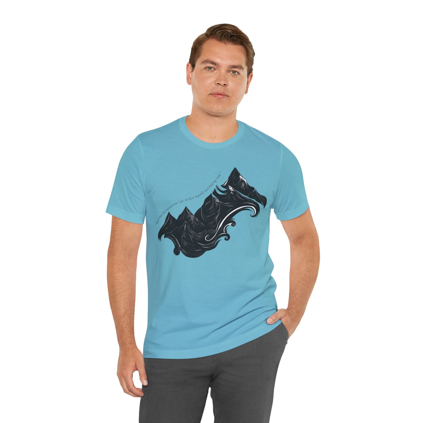 Unisex t-shirt with sketched mountain design and John Muir quote “Into the Mountains I go...” on a model