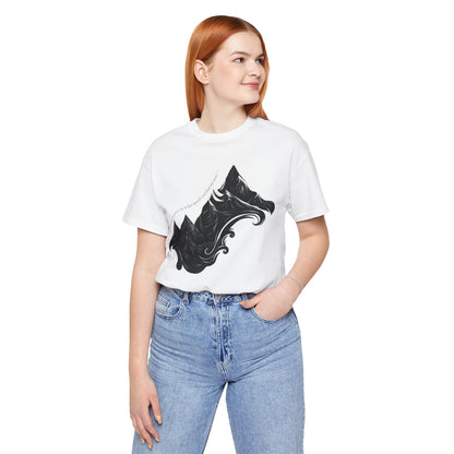 Unisex t-shirt with sketched mountain design and John Muir quote “Into the Mountains I go...”- White on a model