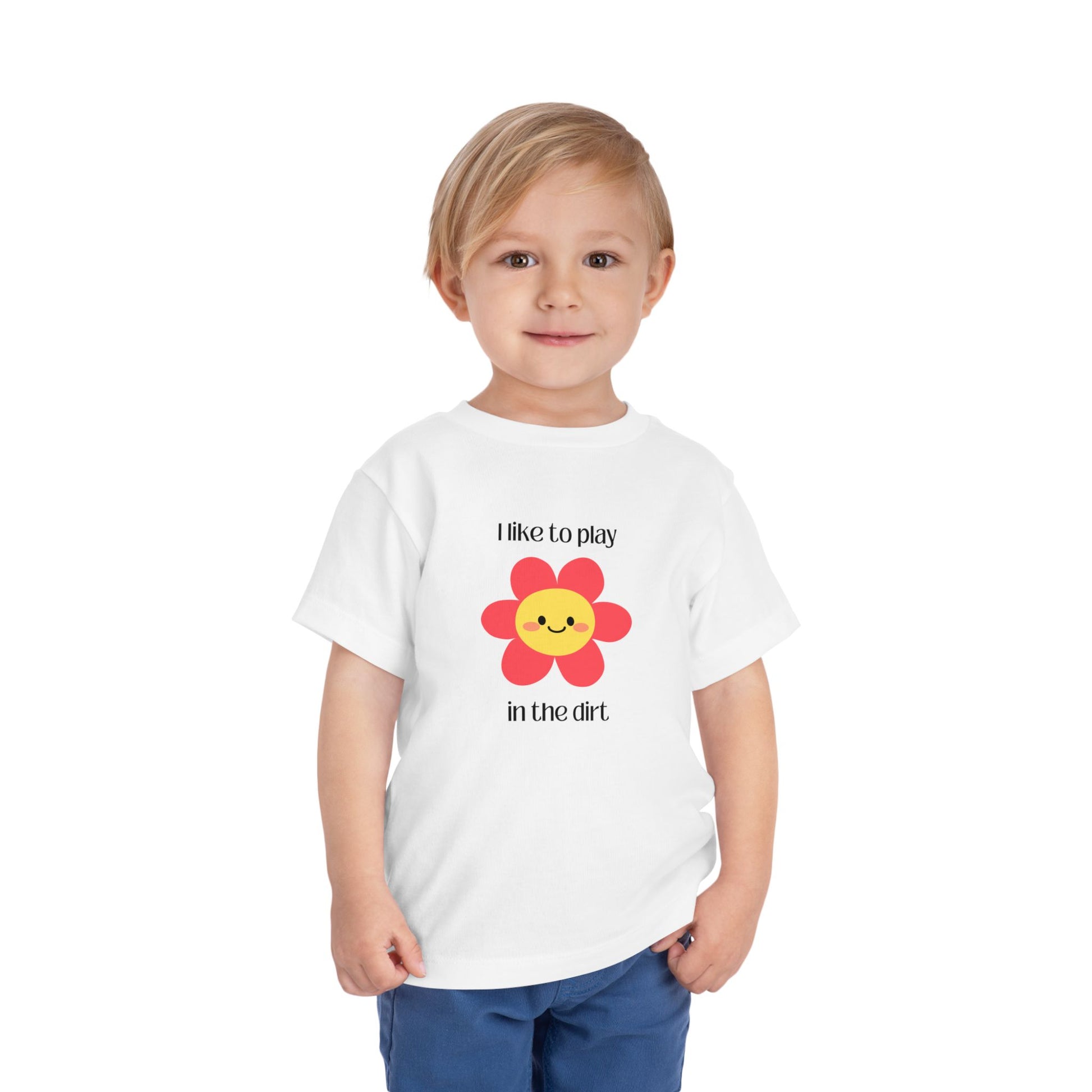 White toddler I like to play in the dirt flower tee with toddler posing