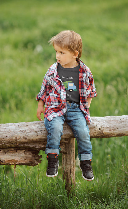 boy on rustic fence  wearing I Like to  play in dirt truck- toddler tee - Asphalt 