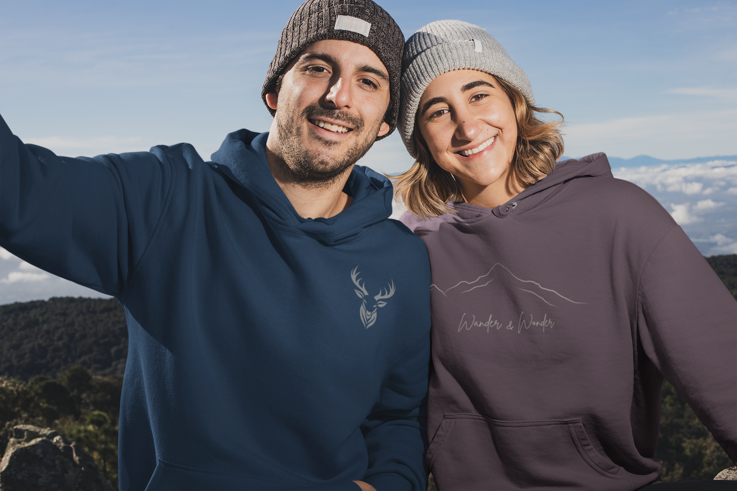 couple in mountain wearing blue deer hunter hoodie