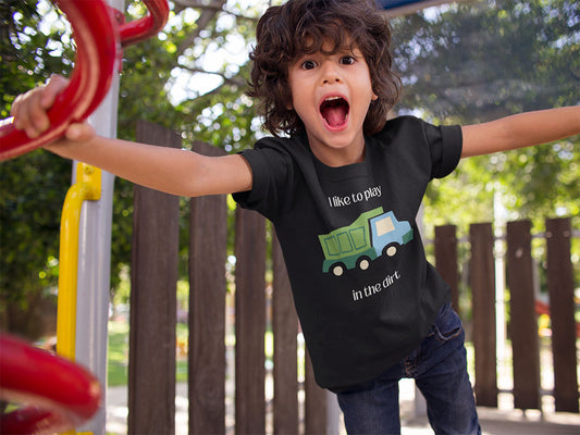 screaming kid wearing "I like to play in the dirt" black t-shirt at the park